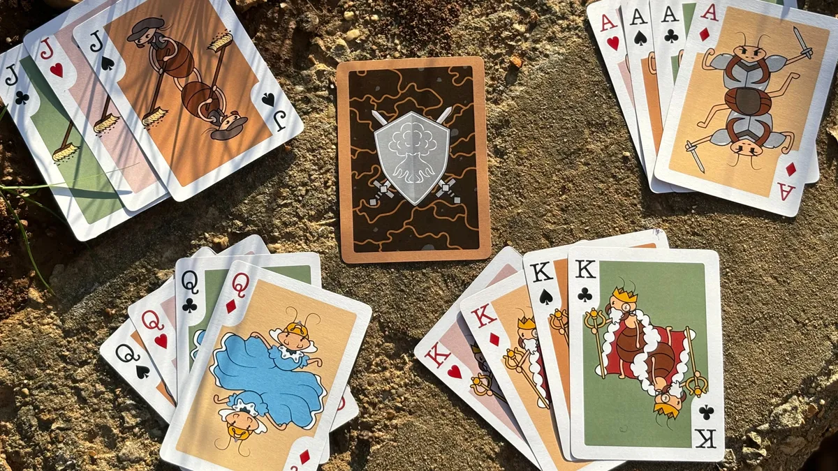 Playing cards with cartoon termite characters