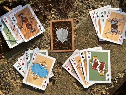 Playing cards with cartoon termite characters